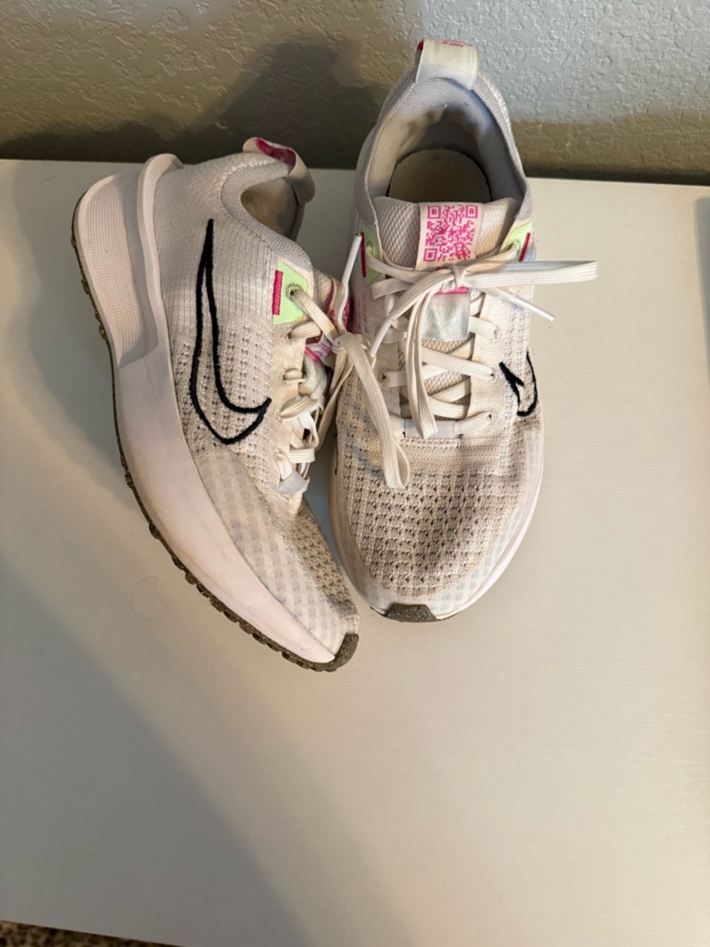 Nike Women's White Running Sneakers with Black Swoosh and Pink Accents